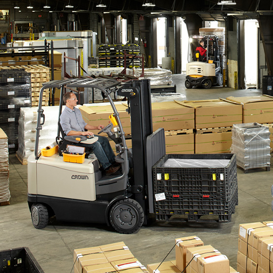 electric forklift transporting goods 